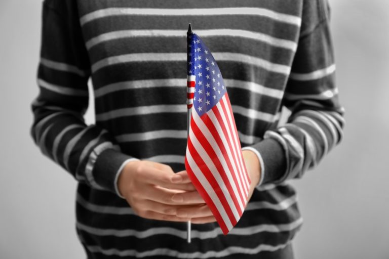 person holding a US flag