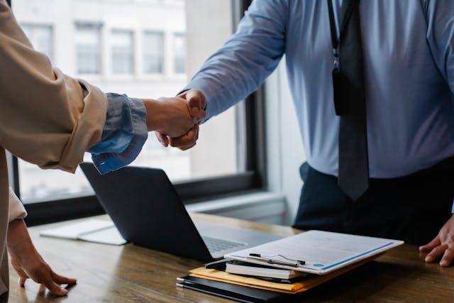 shaking hands in office